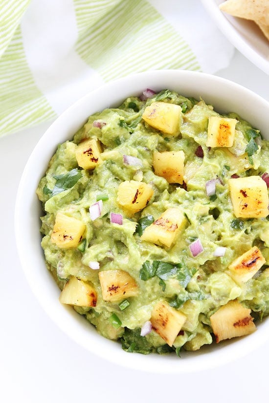 Grilled Pineapple Guacamole Recipe on twopeasandtheirpod.com A must make for summertime! This guacamole is SO good! Grilled Pineapple Guacamole Recipe