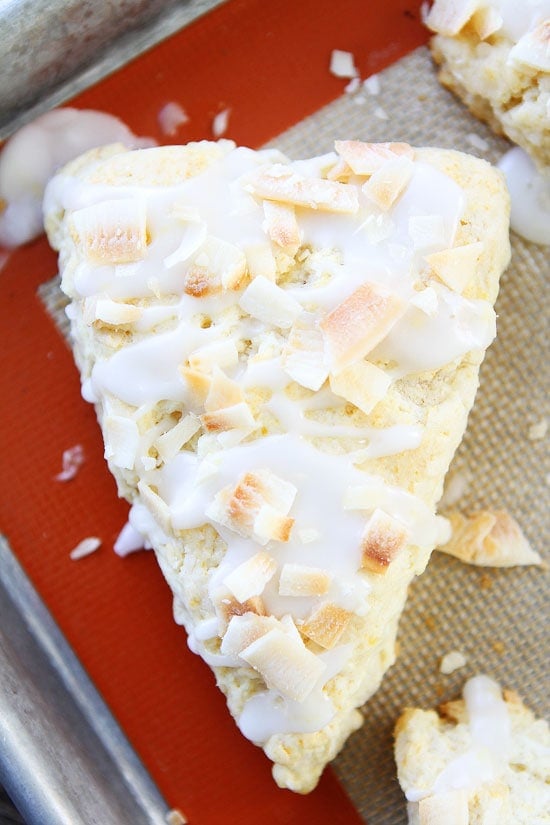 Toasted Coconut Lemon Scones Recipe on twopeasandtheirpod.com The perfect treat for breakfast, brunch, or tea time! The lemon coconut combo is amazing! Toasted Coconut Lemon Scones Recipe