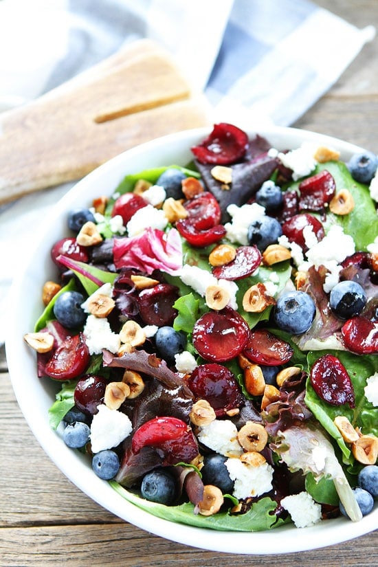 Balsamic Grilled Cherry, Blueberry, Goat Cheese, and Candied Hazelnut Salad Recipe on twopeasandtheirpod.com This is the BEST salad for summertime! Balsamic Grilled Cherry, Blueberry, Goat Cheese, and Candied Hazelnut Salad Recipe