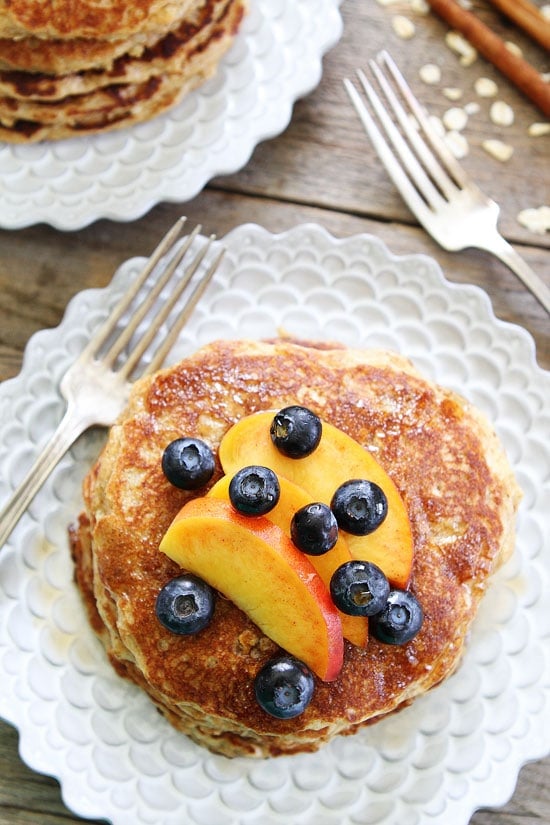 Cinnamon Oatmeal Pancakes Recipe on twopeasandtheirpod.com Start your morning with a stack of these healthy and hearty pancakes! making oatmeal pancakes homemade