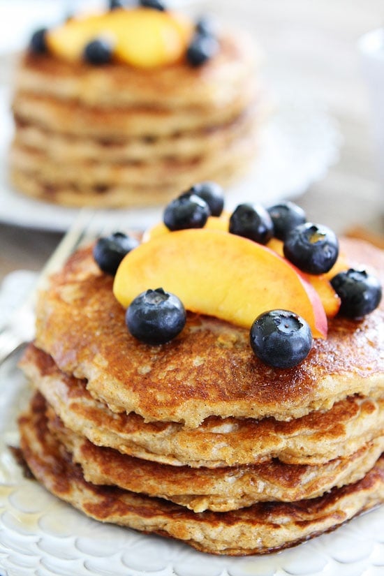 Cinnamon Oatmeal Pancakes Recipe on twopeasandtheirpod.com These pancakes are perfection! Plus, the batter can be made in advance and they freeze well too! Easy Oatmeal Pancakes with cinnamon and blueberries