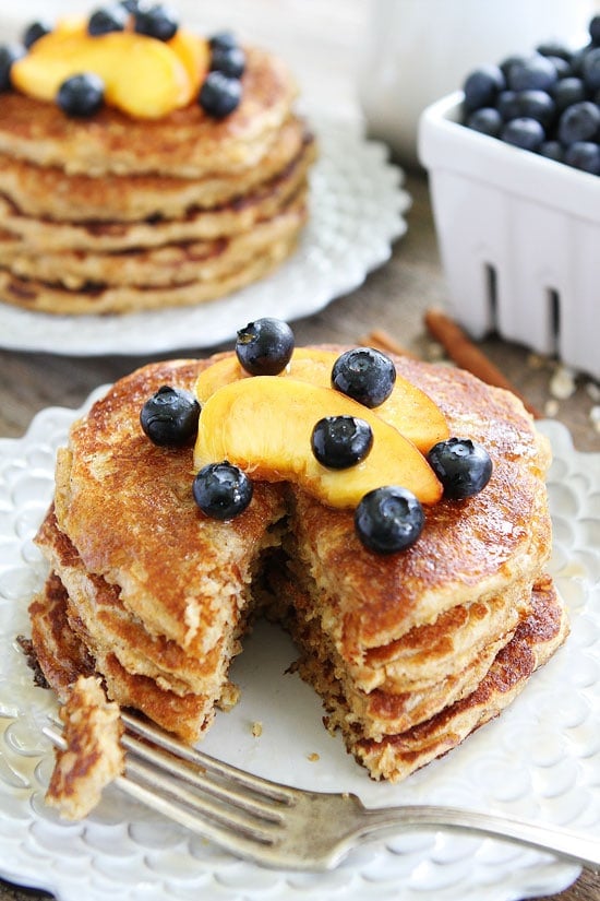 Cinnamon Oatmeal Pancakes Recipe on twopeasandtheirpod.com These healthy and hearty pancakes are perfection! Enjoy them for breakfast or dinner! Eating Cinnamon Oatmeal Pancakes