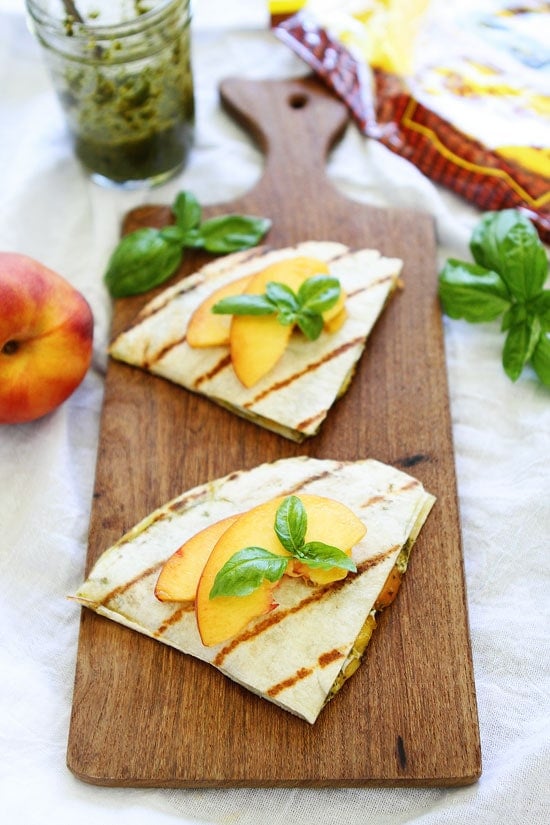 Grilled Peach, Pesto, and Mozzarella Quesadillas Recipe on twopeasandtheirpod.com You only need 4 ingredients to make these delicious quesadillas! They are great for lunch, dinner, or served as an appetizer or snack! Grilled Peach, Pesto, and Mozzarella Quesadillas Recipe