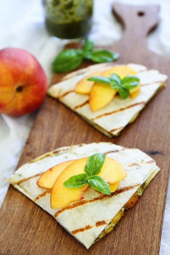 Grilled Peach, Pesto, and Mozzarella Quesadillas Recipe on twopeasandtheirpod.com You only need 4 ingredients to make these delicious summer quesadillas! Peach, Pesto, and Mozzarella Quesadillas Recipe