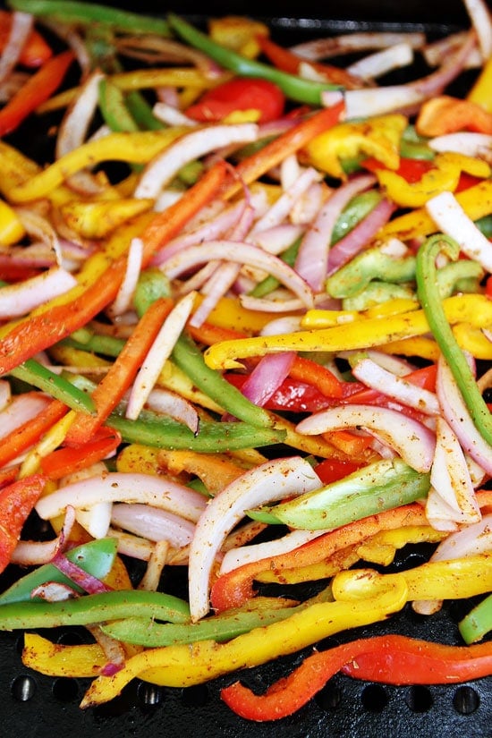 Grilled Steak Fajitas Recipe on twopeasandtheirpod.com How to make steak fajitas with onions and peppers