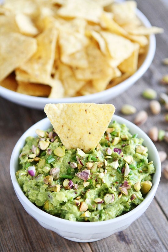 Pistachio Guacamole Recipe on twopeasandtheirpod.com I love the addition of pistachios! This guacamole is SO good! Pistachio Guacamole Recipe