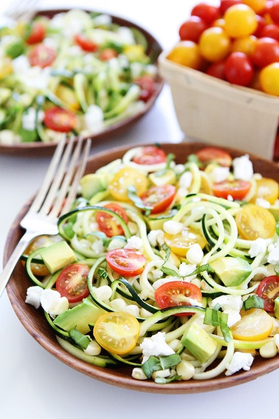 Summer Zucchini Noodle Salad Recipe on twopeasandtheirpod.com Zucchini noodles with tomatoes, corn, avocado, goat cheese, basil and a simple vinaigrette. The perfect summer salad! Summer Zucchini Noodle Salad Recipe