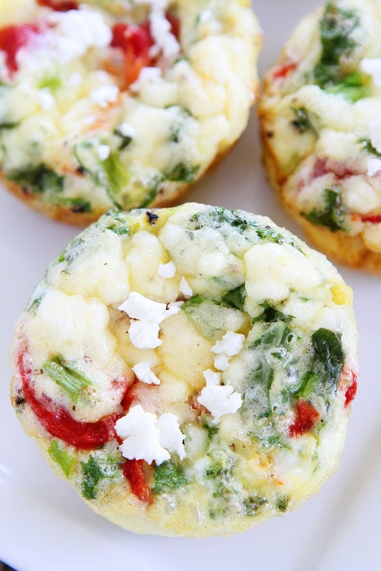 Egg Muffins with Kale, Roasted Red Peppers, and Feta Cheese Recipe on twopeasandtheirpod.com These healthy egg muffins are great for busy mornings! Egg Muffin Recipe