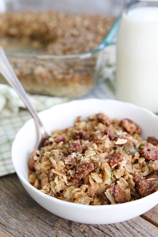 Zucchini Bread Baked Oatmeal Recipe on twopeasandtheirpod.com This healthy baked oatmeal will remind you of your favorite zucchini bread! Make a pan and reheat during the week for easy breakfasts! Zucchini Bread Baked Oatmeal in bowl with spoon