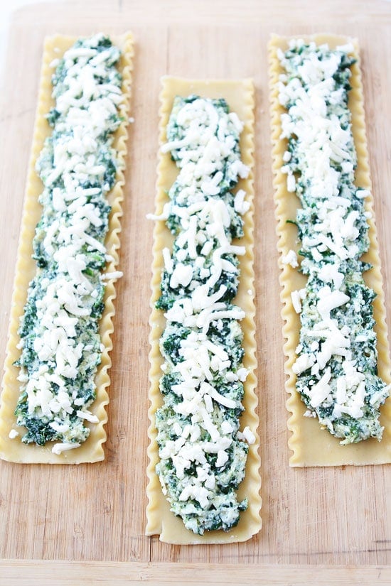 Pesto Lasagna Roll Ups Recipe on twopeasandtheirpod.com You will love this fun and easy twist on traditional lasagna! Pesto Lasagna Roll Ups Recipe