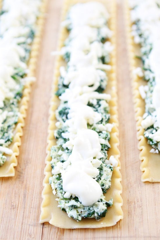 Pesto Lasagna Roll Ups Recipe on twopeasandtheirpod.com Cheesy pesto lasagna all rolled up into individual servings! Fun to make and fun to eat! Pesto Lasagna Roll Ups Recipe