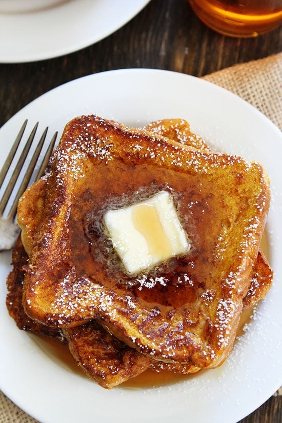 Pumpkin French Toast Recipe on twopeasandtheirpod.com Thick slices of French toast dipped in a pumpkin spice mixture. This is the ultimate fall breakfast! Pumpkin French Toast Recipe