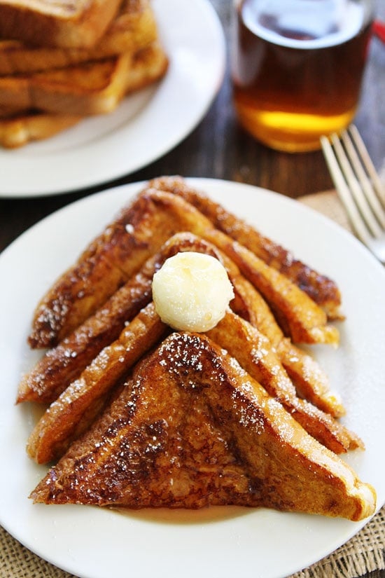 Pumpkin French Toast Recipe on twopeasandtheirpod.com Thick slices of French toast dipped in a pumpkin spice mixture and topped with butter and pure maple syrup! This French toast is the BEST! Pumpkin French Toast Recipe
