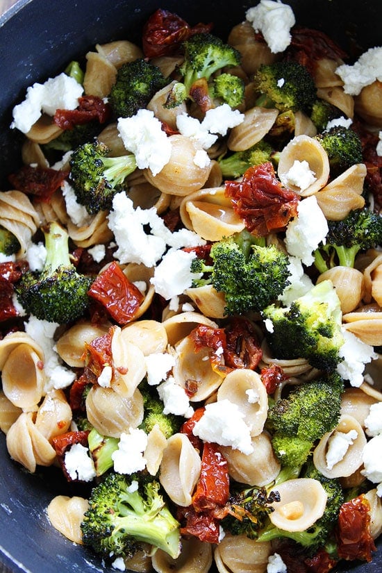 Creamy Goat Cheese Pasta with Roasted Broccoli and Sun-Dried Tomatoes Recipe on twopeasandtheirpod.com This easy pasta dish is perfect for busy weeknights! Pasta with Roasted Broccoli and Sun-Dried Tomatoes Recipe