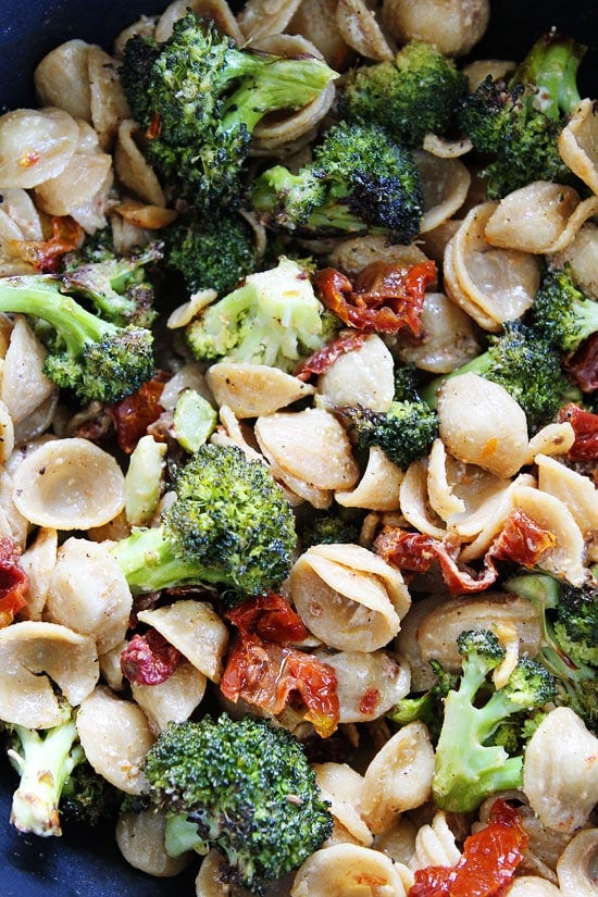 Creamy Goat Cheese Pasta with Roasted Broccoli and Sun-Dried Tomatoes Recipe on twopeasandtheirpod.com This pasta dish is easy to make and a family favorite! Creamy Goat Cheese Pasta with Roasted Broccoli and Sun-Dried Tomatoes Recipe