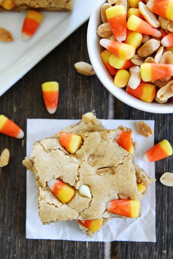 Peanut Butter Candy Corn Blondies Recipe on twopeasandtheirpod.com Peanut butter blondies with salted peanuts and candy corn! This combo is amazing! Such a fun dessert! Peanut Butter Candy Corn Blondies Recipe