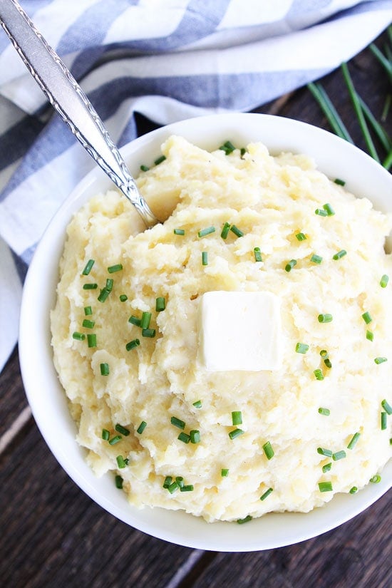 Slow Cooker Mashed Potatoes Recipe on twopeasandtheirpod.com These easy mashed potatoes are made in the crockpot! They are the BEST mashed potatoes and perfect for all of your holiday meals. Slow Cooker Mashed Potatoes Recipe