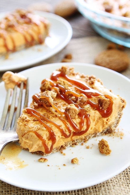 5-Ingredient Pumpkin Ice Cream Pie Recipe on twopeasandtheirpod.com Pumpkin ice cream pie with a simple gingersnap cookie crust and a drizzle of salted caramel sauce. This easy pie is the perfect Thanksgiving dessert! 5-Ingredient Pumpkin Ice Cream Pie Recipe