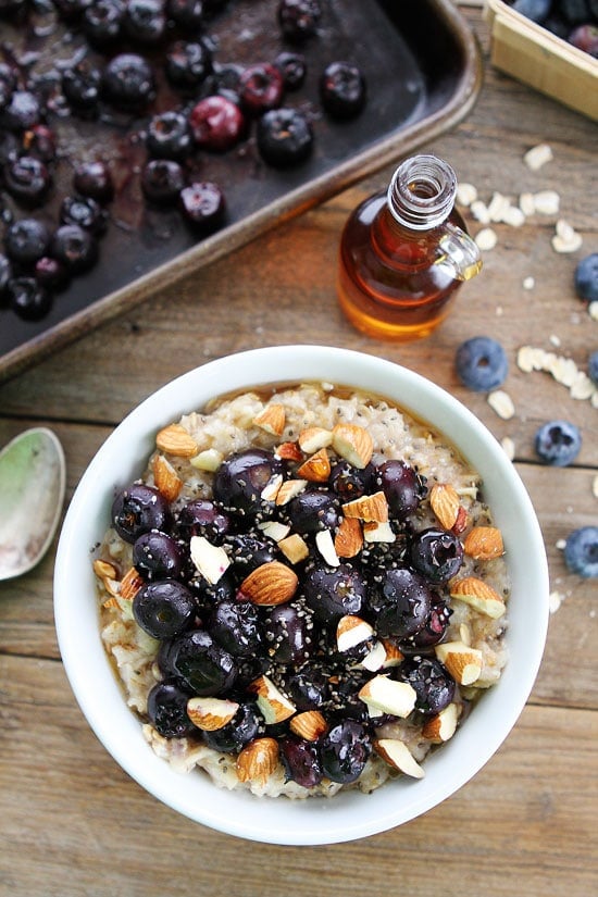 Maple Roasted Blueberry Almond Oatmeal Recipe on twopeasandtheirpod.com Hearty oatmeal topped with maple roasted blueberries, almonds, and chia seeds. The perfect way to start any day! Maple Roasted Blueberry Almond Oatmeal