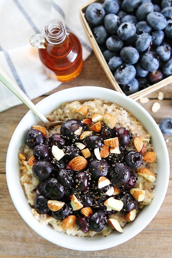 Maple Roasted Blueberry Almond Oatmeal Recipe on twopeasandtheirpod.com Hearty oatmeal topped with maple roasted blueberries, almonds, and chia seeds. We love this easy and delicious oatmeal! Maple Roasted Blueberry Almond Oatmeal Recipe