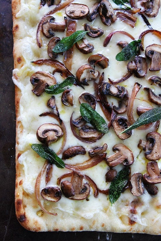 Mushroom Fontina Flatbread with Crispy Sage Recipe on twopeasandtheirpod.com This easy and cheesy flatbread can be made in 30 minutes. It is always a hit at parties or the dinner table! Mushroom Fontina Flatbread with Crispy Sage Recipe