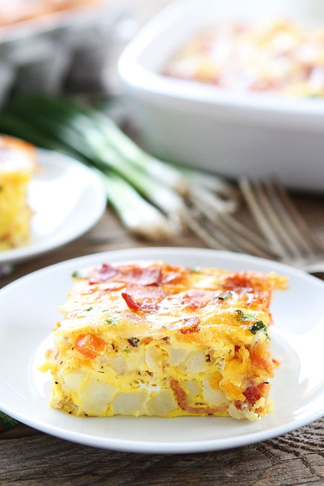 Bacon, Potato, and Egg Casserole Recipe on twopeasandtheirpod.com This easy egg casserole is packed with bacon, potatoes, and cheese! It can be made in advance and is a real crowd pleaser! Easy Breakfast Casserole Recipe with Potato, Egg and Bacon