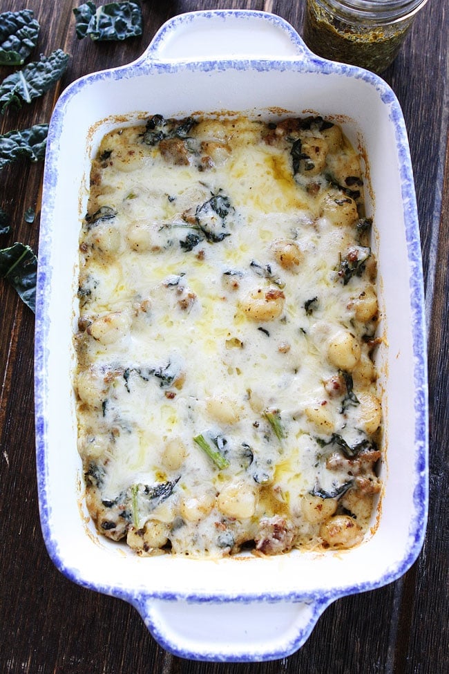 Baked Gnocchi with Sausage, Kale, and Pesto Recipe on twopeasandtheirpod.com This simple and comforting casserole is great for busy weeknight dinners or easy entertaining! Baked Gnocchi with Sausage, Kale, and Pesto Recipe