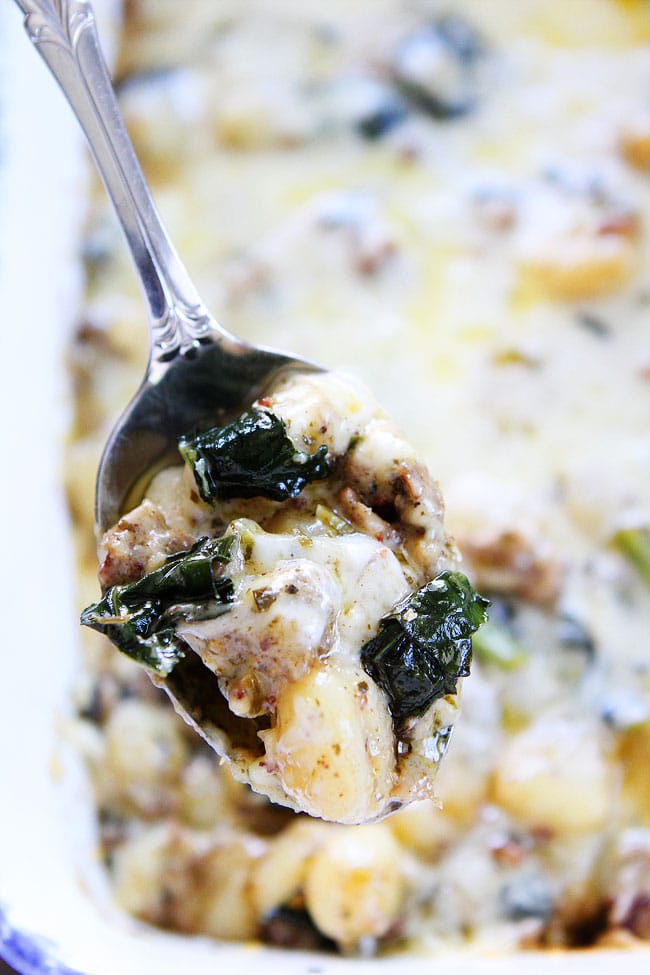 Baked Gnocchi with Sausage, Kale, and Pesto Recipe on twopeasandtheirpod.com This easy and comforting baked gnocchi dish is a family favorite! Add it to your dinner menu now! Baked Gnocchi with Sausage, Kale, and Pesto Recipe