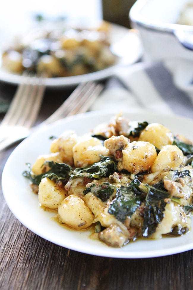 Baked Gnocchi with Sausage, Kale, and Pesto Recipe on twopeasandtheirpod.com This easy and comforting baked gnocchi dish is a family favorite! A meal everyone will love! Baked Gnocchi with Sausage, Kale, and Pesto Recipe