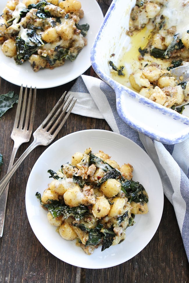 Baked Gnocchi with Sausage, Kale, and Pesto Recipe on twopeasandtheirpod.com This easy and comforting baked gnocchi dish is a family favorite! Make it for dinner tonight! Baked Gnocchi with Sausage, Kale, and Pesto