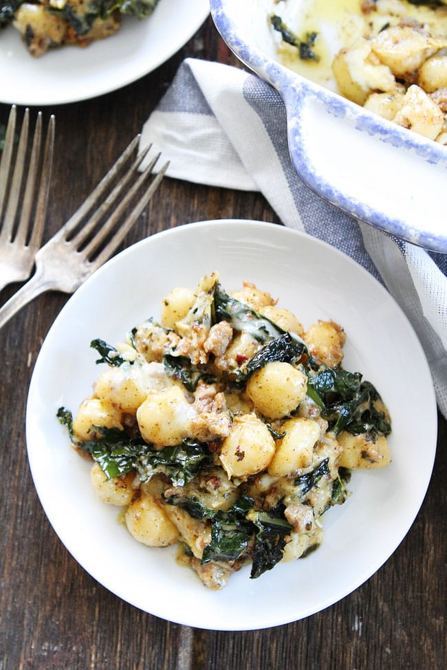 Baked Gnocchi with Sausage, Kale, and Pesto Recipe on twopeasandtheirpod.com This easy casserole is a family favorite! Add it to your dinner menu now! Baked Gnocchi with Sausage, Kale, and Pesto Recipe