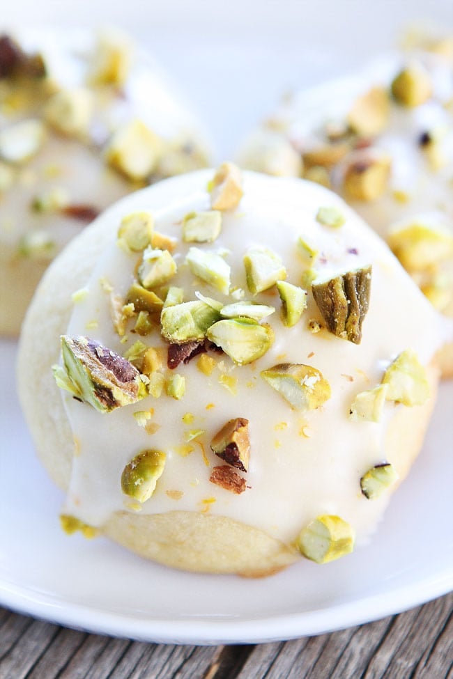 Orange Pistachio Cookie Recipe on twopeasandtheirpod.com Orange butter cookies with a sweet orange glaze and chopped pistachios. These cookies are amazing! Orange Pistachio Cookie Recipe