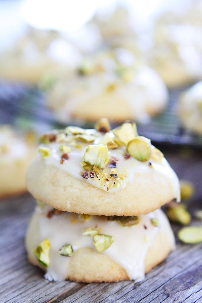 Orange Pistachio Cookie Recipe on twopeasandtheirpod.com Orange butter cookies with a sweet orange glaze and chopped pistachios. These cookies are amazing! Orange Pistachio Cookie Recipe