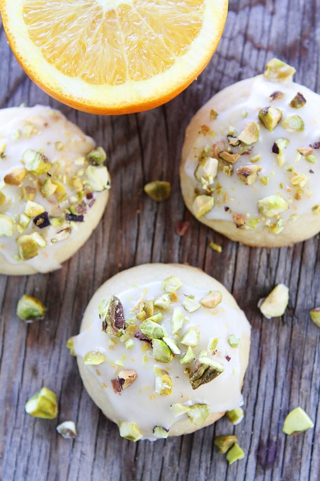 Orange Pistachio Cookie Recipe on twopeasandtheirpod.com Orange butter cookies with a sweet orange glaze and chopped pistachios. These cookies are SO good! Orange Pistachio Cookie Recipe