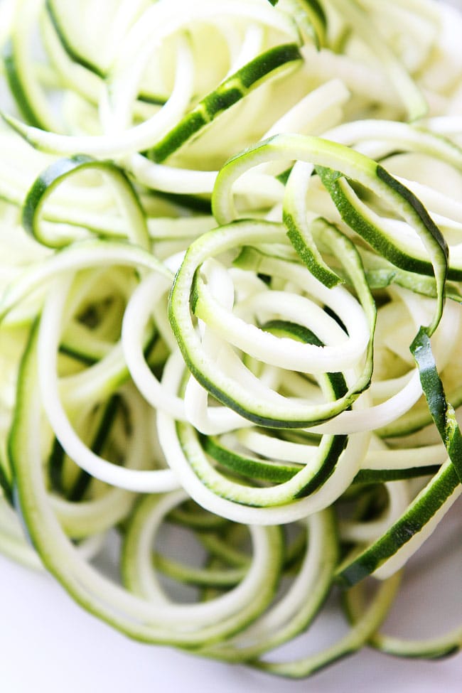 5-Ingredient Spinach Parmesan Zucchini Noodles Recipe on twopeasandtheirpod.com Fresh, curly zucchini noodles