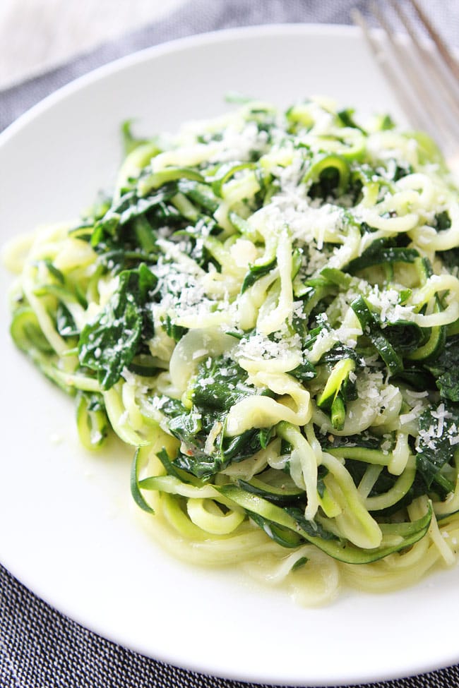 5-Ingredient Spinach Parmesan Zucchini Noodles Recipe on twopeasandtheirpod.com You only need 5 ingredients and 20 minutes to make this easy and healthy dish! It is a favorite at our house! Zucchini Noodles tossed with cooked spinach and parmesan cheese