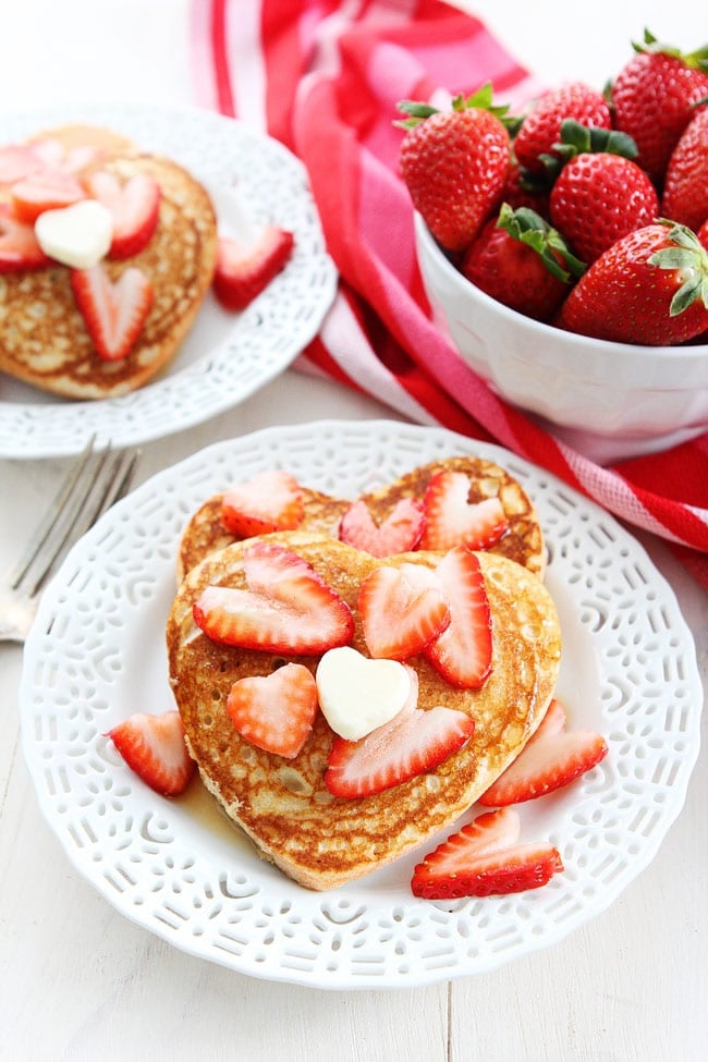 Heart Pancakes Recipe on twopeasandtheirpod.com These easy heart shaped pancakes are perfect for Valentine's Day! Heart Pancakes Recipe