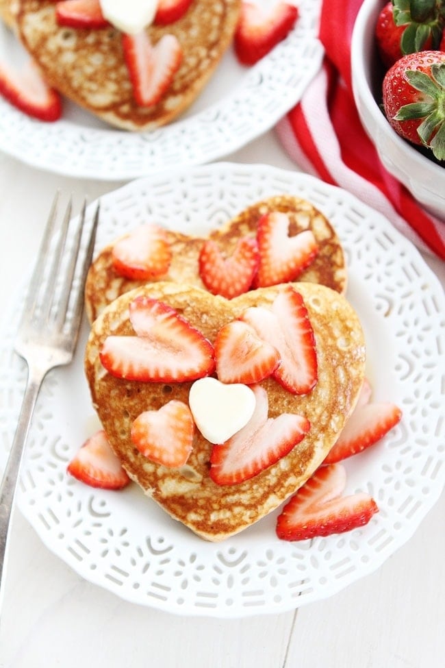 Heart Pancakes Recipe on twopeasandtheirpod.com These simple heart shaped pancakes are perfect for Valentine's Day! Heart Pancakes Recipe