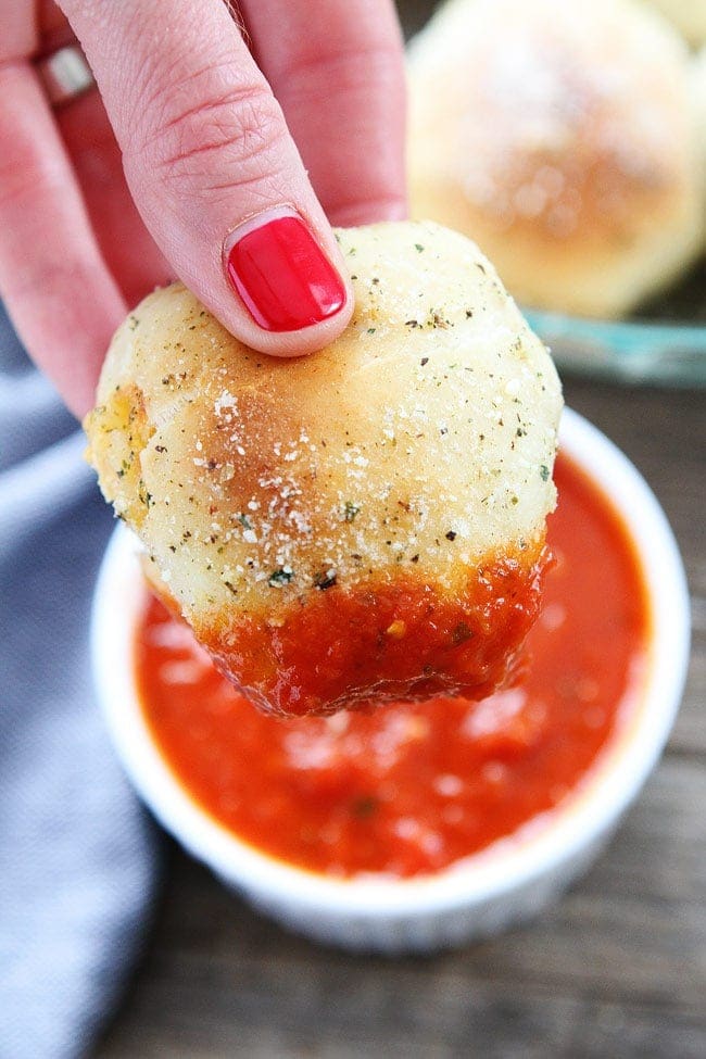 Pepperoni Pizza Rolls Recipe on twopeasandtheirpod.com Easy pizza rolls stuffed with pepperoni, cheese, and brushed with garlic butter. Dip in pizza sauce or marinara sauce! and serve! dipping homemade pizza rolls in marinara