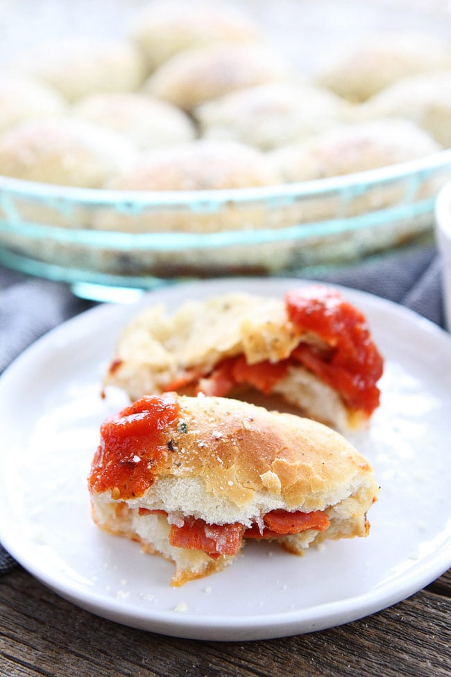 Pepperoni Pizza Rolls Recipe on twopeasandtheirpod.com Easy pizza rolls stuffed with pepperoni, cheese, and brushed with garlic butter. Kids and adults love these pizza rolls! Easy Homemade Pepperoni Pizza Rolls Recipe