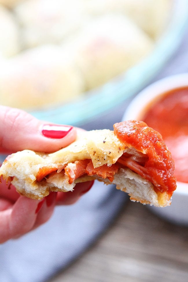 Pepperoni Pizza Rolls Recipe on twopeasandtheirpod.com These easy pizza rolls are great for parties, game day, or any day! Dip in pizza sauce or marinara sauce! Homemade Pepperoni Rolls Dipped in Marinara
