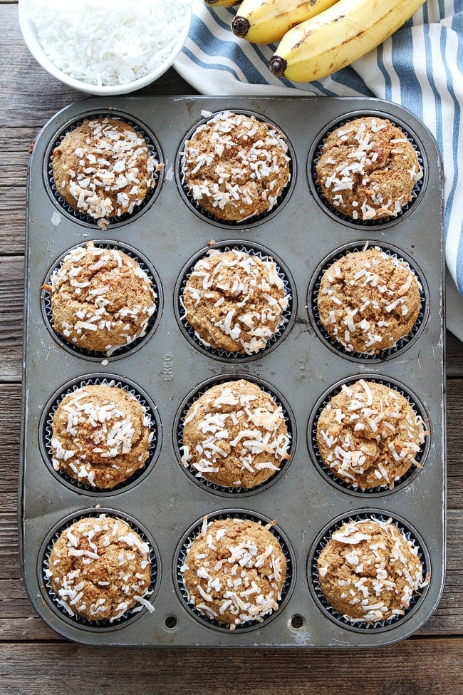 Whole Wheat Banana Coconut Muffins Recipe on twopeasandtheirpod.com These healthy muffins are made with whole wheat flour, bananas, coconut oil, coconut milk, coconut sugar, and coconut! Whole Wheat Banana Coconut Muffins Recipe