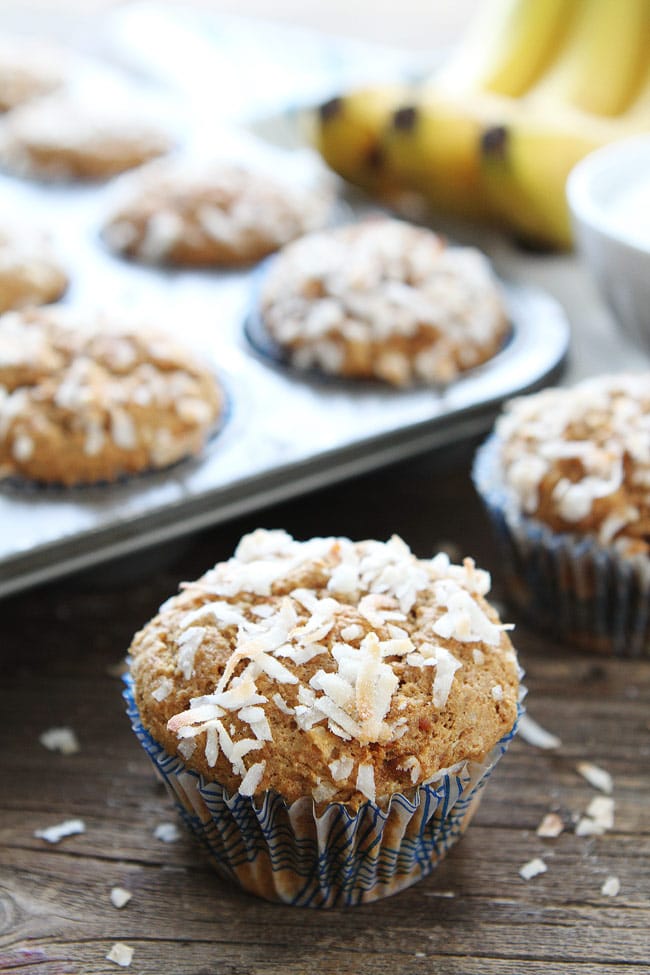 Whole Wheat Banana Coconut Muffins Recipe on twopeasandtheirpod.com These healthy muffins are easy to make and are great for breakfast or snack time! Whole Wheat Banana Coconut Muffins Recipe