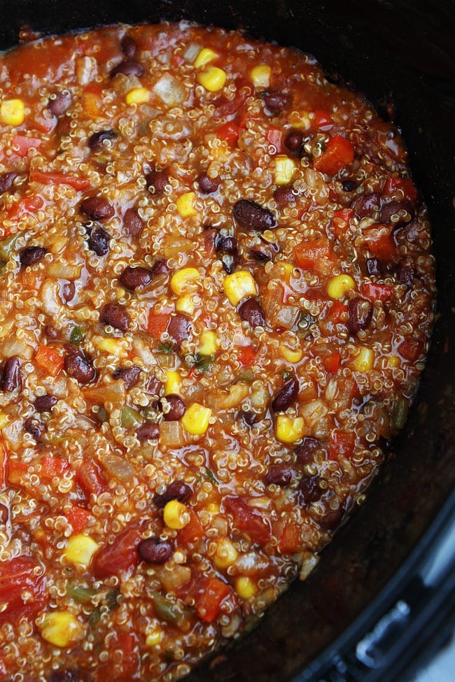 Slow Cooker Enchilada Quinoa Recipe on twopeasandtheirpod.com This easy crockpot meal is always a favorite! Slow Cooker Enchilada Quinoa Recipe