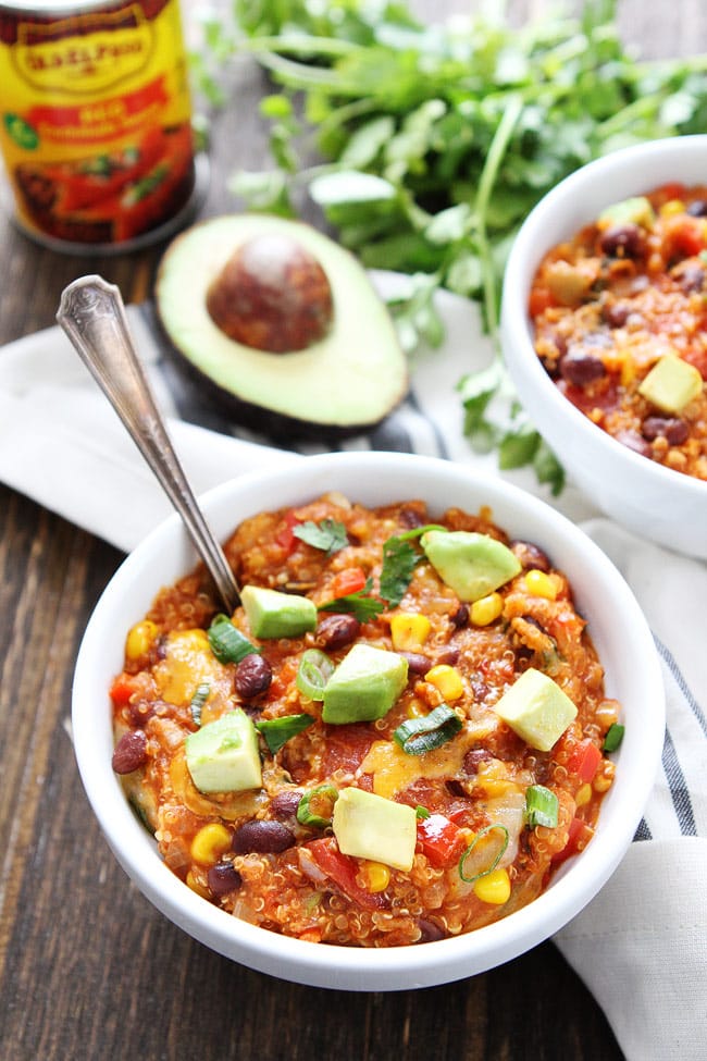 Slow Cooker Enchilada Quinoa Recipe on twopeasandtheirpod.com This slow cooker meal is a family favorite and it is SO easy to make! Slow Cooker Enchilada Quinoa Recipe