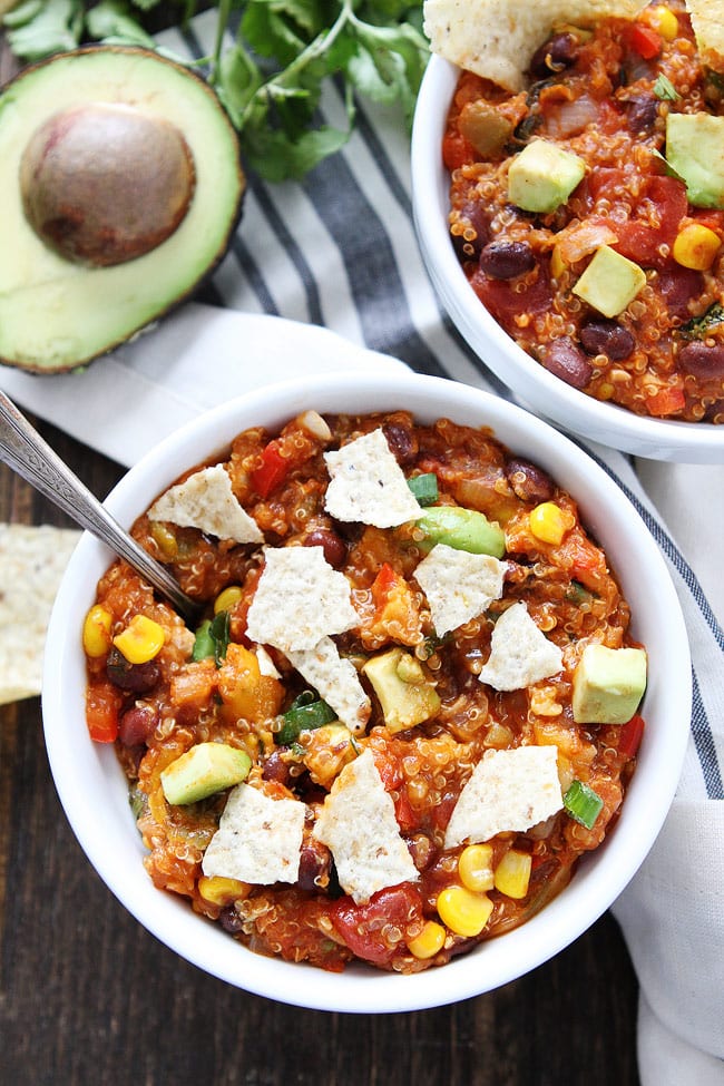 Slow Cooker Enchilada Quinoa Recipe on twopeasandtheirpod.com The entire family will love this easy slow cooker meal! Serve tortilla chips or tortillas on the side! Slow Cooker Enchilada Quinoa Recipe