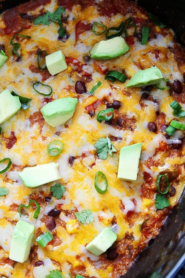 Slow Cooker Enchilada Quinoa Recipe on twopeasandtheirpod.com This easy crockpot meal is a favorite in our house! Slow Cooker Enchilada Quinoa Recipe