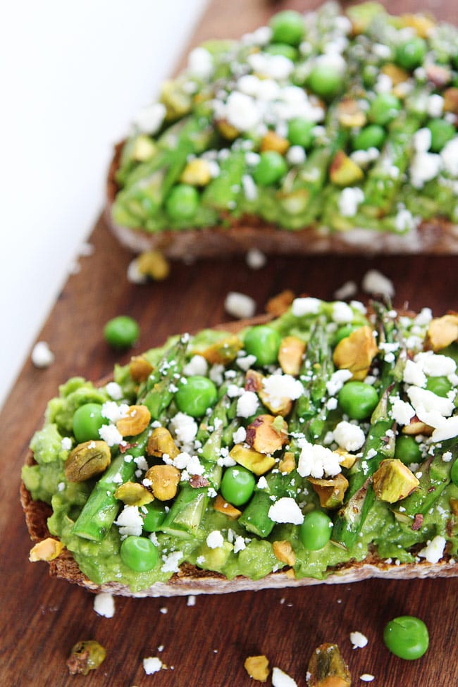 Avocado Asparagus Toast Recipe on twopeasandtheirpod.com Avocado toast with asparagus, peas, pistachios, and feta cheese. This simple spring toast is amazing! Avocado Asparagus Toast Recipe
