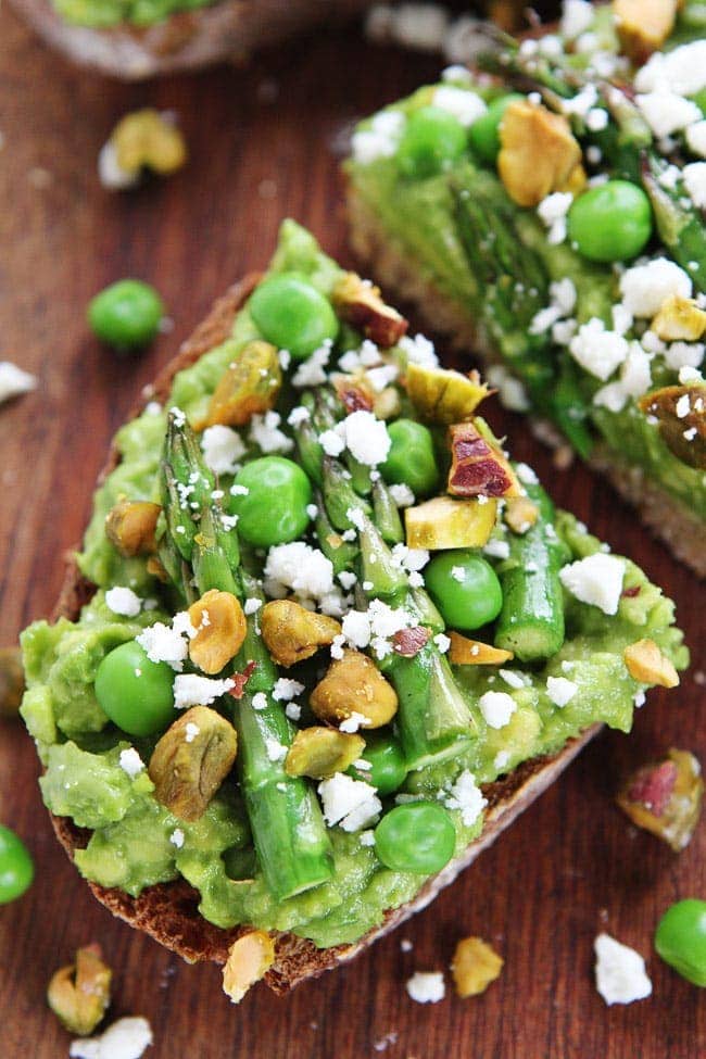 Avocado Asparagus Toast Recipe on twopeasandtheirpod.com Avocado toast with asparagus, peas, pistachios, and feta cheese. The perfect spring toast! Avocado Asparagus Toast Recipe