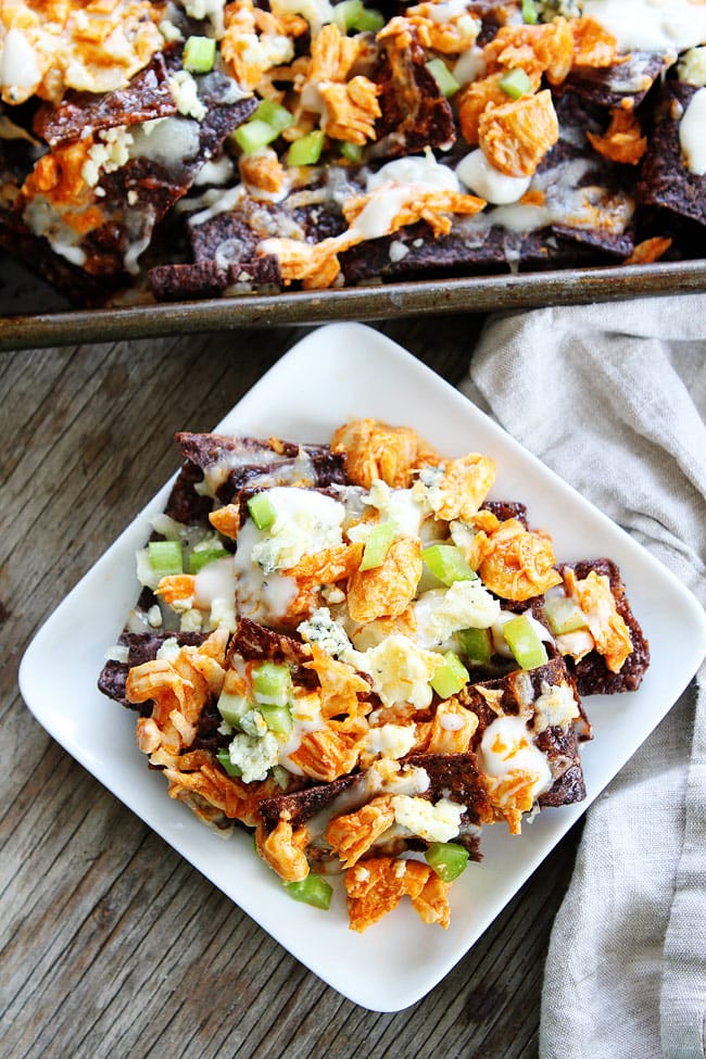 Buffalo Chicken Nachos Recipe on twopeasandtheirpod.com The ultimate game day food! Buffalo Chicken Nachos Recipe